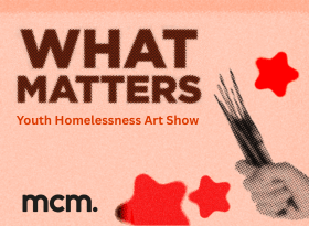 Brown text "What Matters Art Exhibition" grayscale fist holding paintbrushes, red stars