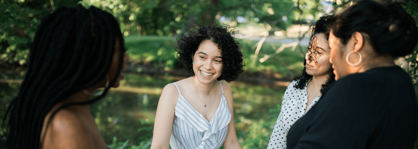 women outside smiling