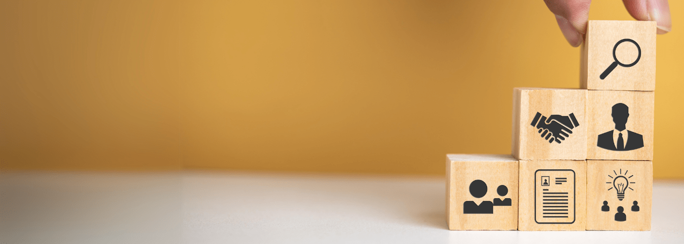 6 stacked blocks in a stair formation with images of resources in front of a yellow wall