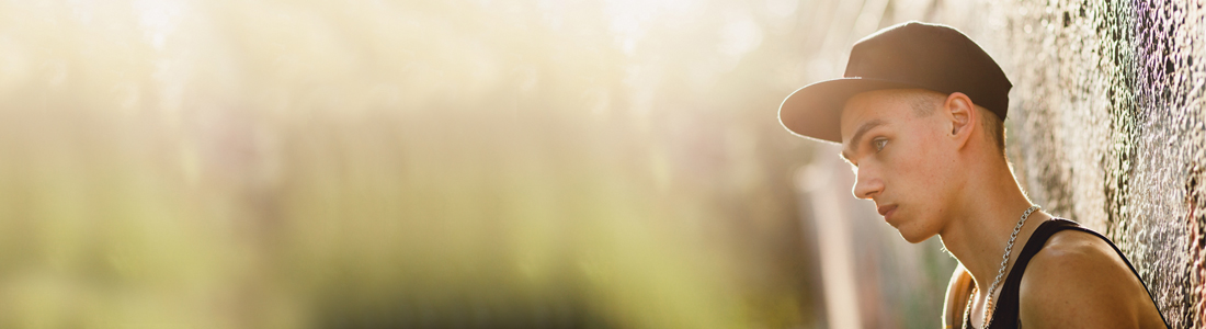 A photo of a young man looking pensive.