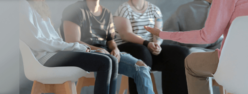 Photo of youth sitting in a group