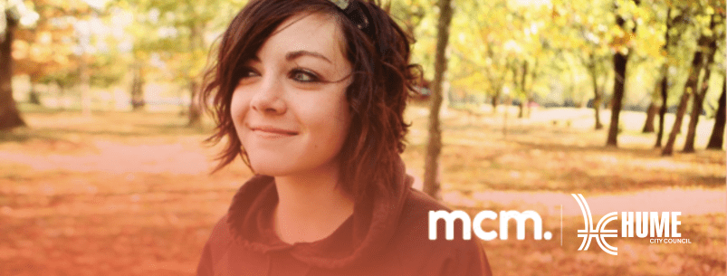 Photo of a teenage girl in a park with the mcm and hume council logos