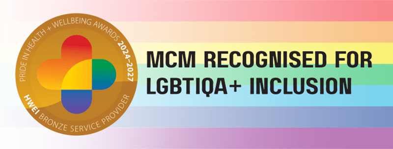 Banner featuring a Pride-themed background with rainbow stripes. A circular badge on the left reads “Pride in Health + Wellbeing Awards 2024–2027 – HWEI Bronze Service Provider.” Bold black text on the right reads “MCM Recognised for LGBTIQA+ Inclusion.”