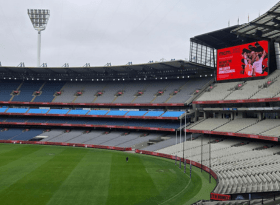 Photo of MCG stands with Sleep At The G on the scoreboard
