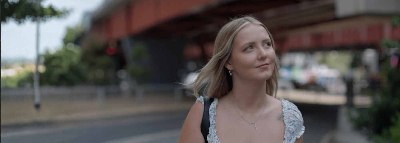 ollie and imogen leaning against brick wall