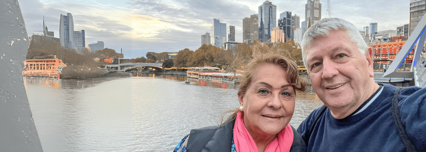 older couple taking a selfie across the yarra