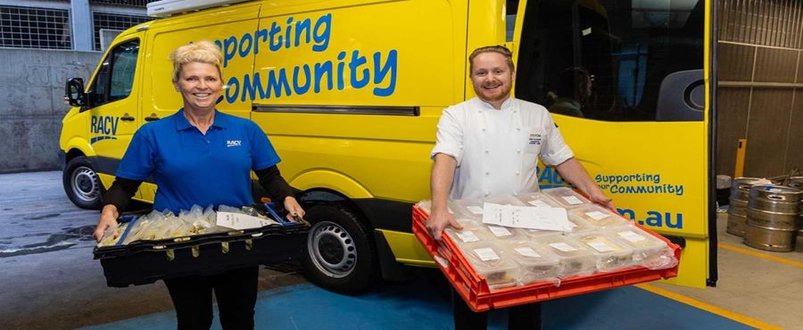 Two RACV employees delivering food 