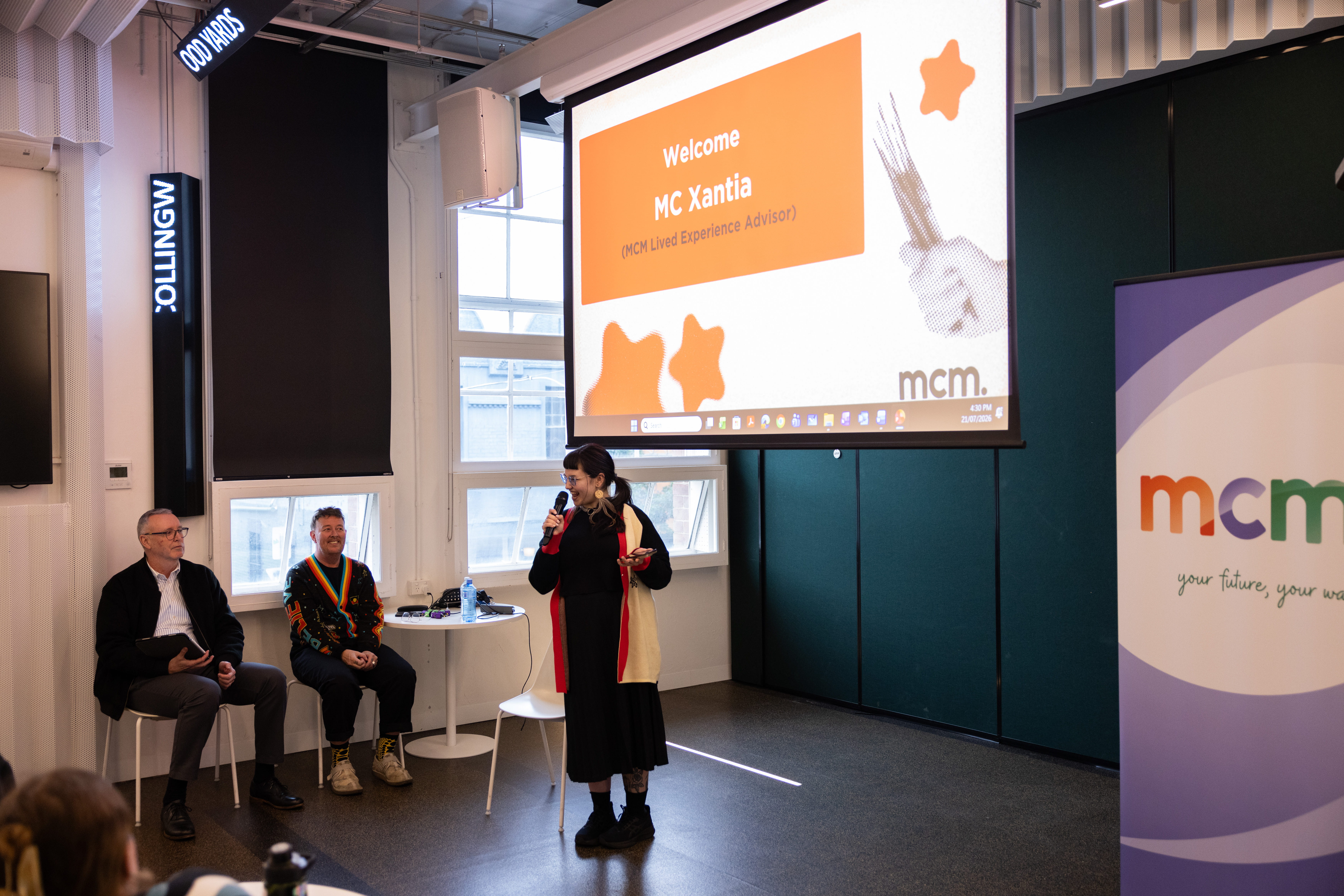Xantia, Lived Experience Advisor at MCM, gives a speech at the What Matters Youth Homelessness Art Exhibition.