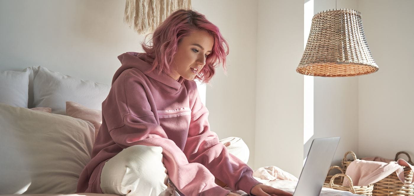 Pink hair girl on laptop